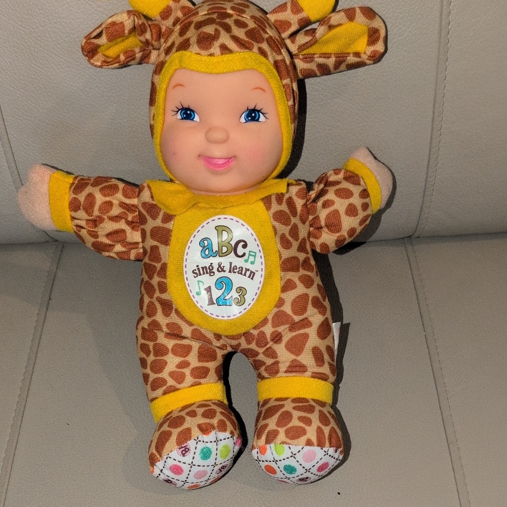 Giraffe Print ABC Learning Doll with Yellow Accents Sings